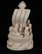 A Chinese carved ivory figural group in a boat, 19th/20th century, carved seal mark to base, ​​​​​​​12.5cm high - 3