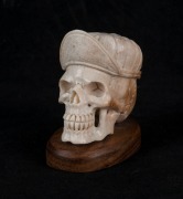 A carved antler skull statue on wooden base, 20th century, 7cm high overall - 2