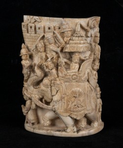 An Indian carved mammoth ivory fragment with elephant procession, 20th century, 13cm high
