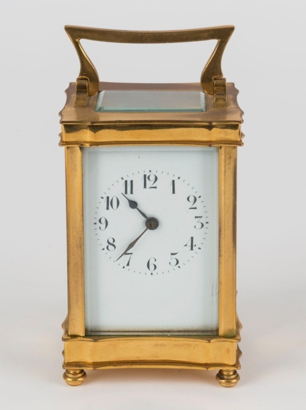 A French carriage clock in brass case with Arabic numerals, early 20th century, 15cm high including handle