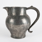 An antique pewter ale jug, 18h/19th century, 24cm high, 27cm wide