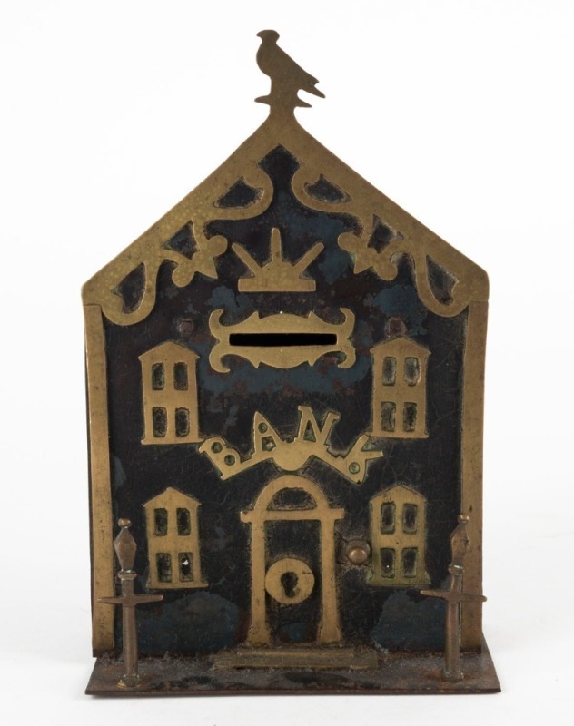 An antique brass and iron architectural money bank, 19th century, 20.5cm high