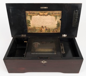 An antique Swiss music box with transfer decorated case, plays eight aires with original lithograph song sheet, 19th century, movement runs well, 12cm high, 37cm wide, 19cm deep