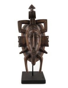 A ceremonial mask, carved wood on later metal stand, Senufo tribe, African origin, ​​​​​​​34cm high