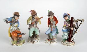 DRESDEN group of four German porcelain "MONKEY BAND" statues, 20th century, blue factory mark to base, the largest 14.5cm high