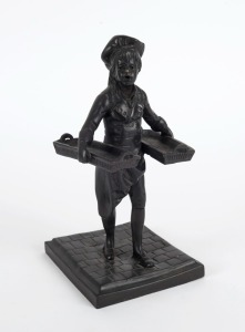 ARTIST UNKNOWN, cast bronze statue of a boy carrying two baskets, 20th century, 22cm high