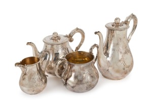 An antique silver four piece tea service in fitted timber case, 19th century, the coffee pot 23cm high, 2050 grams total