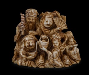 An impressive Japanese carved ivory netsuke figural group, Meiji period, two character seal mark to base, 5cm high, 6.2cm wide