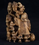 A Japanese carved ivory netsuke figural group of the climbing boys, Meiji period, red seal mark to base, 7.​​​​​​​5cm high, 5.5cm wide - 2