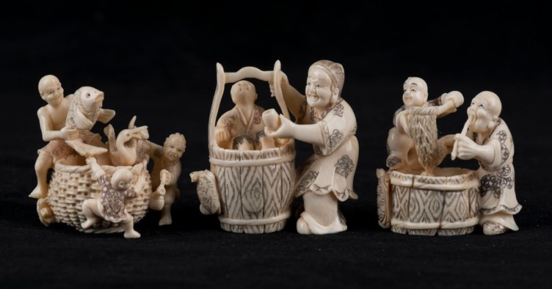 Three Japanese carved ivory netsuke figural groups, Meiji period, the largest 4.5cm high, 4.5cm wide