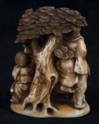 A Japanese carved ivory netsuke figural group with tree, serpent, dragon, figures and lion, Meiji period, ​​​​​​​two character mark to base, 6.5cm high - 2