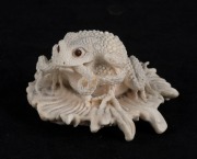 A carved antler toad and snake figural group, 20th century, 5cm high, 9cm wide