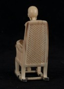 A carved antler and silver statue of a skeleton figure in a rocking chair, 20th century, 9cm high  - 3