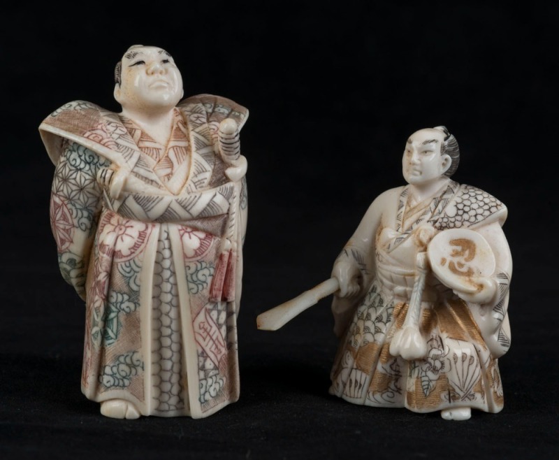 Two Japanese carved ivory samurai netsuke with hand-painted finish, Meiji period, 20th century, ​​​​​​​6cm and 7.5cm high