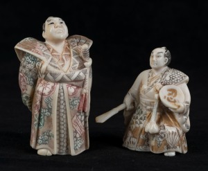 Two Japanese carved ivory samurai netsuke with hand-painted finish, Meiji period, 20th century, 6cm and 7.5cm high