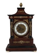 An antique Viennese mantle clock with 30 hour time and strike movement and automata dial of Putti working an anvil. Mahogany case with ebonized mouldings and ormolu mounts, early 19th century, 42cm high