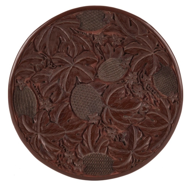 An antique Chinese cinnabar lacquered plate with lychee fruit decoration, Qing Dynasty, 18th/19th, note decorated on the reverse as well. ​​​​​​​20cm diameter