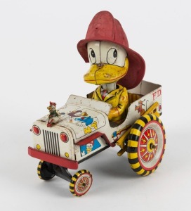 "Mickey Fire Engine" with Donald Duck in the driver's seat; crazy-action wind-up toy, circa 1960s, by Line Mar Toys, Japan, in association with Walt Disney Productions.