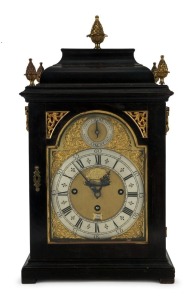 Georgian antique English spring table clock in ebonized bell top case with ormolu mounts, verge escapement three train fusee movement, striking the quarters on a nest of six bells, and the hour on a larger bell, dial marked "ANDREW DUNLOP, LONDON", circa 