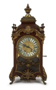 VINCENTI & Co. antique French spring driven table clock with eight day time and gong striking movement with Brocot time adjustment above the 12. Housed in a mahogany case with ormolu mounts, 19th century, 59cm high