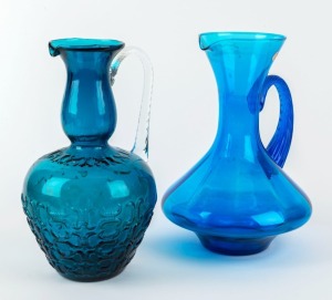 Two Continental blue glass jugs, 20th century, one with original label "Made In Italy", ​​​​​​​28cm and 29cm high