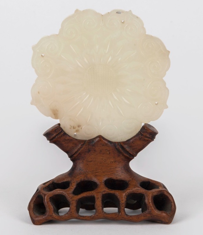 An antique Chinese carved mutton jade ornament on carved timber stand, Qing Dynasty, 19th century or earlier, ​​​​​​​12cm high overall