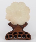 An antique Chinese carved mutton jade ornament on carved timber stand, Qing Dynasty, 19th century or earlier, ​​​​​​​12cm high overall