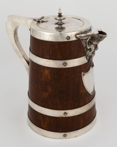 An antique English oak ale jug with silver plated mounts, 19th century, 23cm high