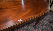 A Georgian mahogany fold-over tea table with square tapering legs and spade feet, early 19th century, 74cm high., by 103cm wide by 45cm deep   - 4