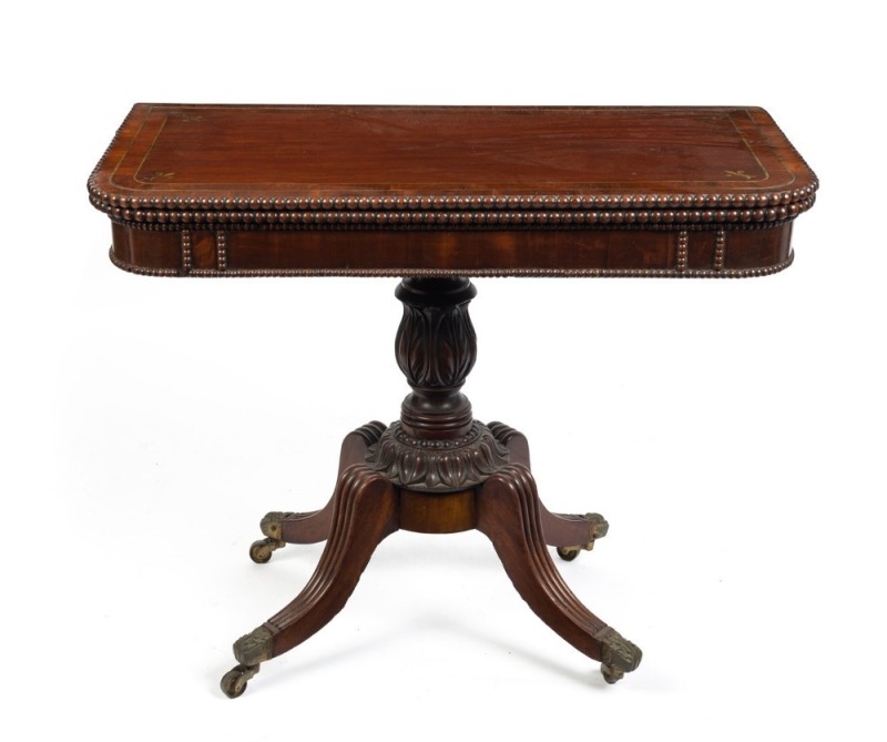 A Georgian mahogany fold-over tea table with brass inlay and casuarina cross banding, early 19th century, 75cm high, 95cm wide, 48cm deep  