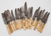 Sixteen assorted antique bone and ivory handled knives, plus an antique carving knife and fork, 19th century, (18 items), the carving knife 32cm long