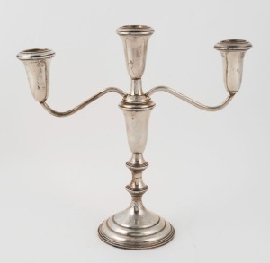 A sterling silver three branch candelabra with weighted base, 20th century, stamped "STERLING", 24cm high