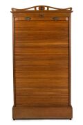 An antique American oak estate cabinet with tambour front, late 19th century, 171cm high, 88cm high, 50cm deep