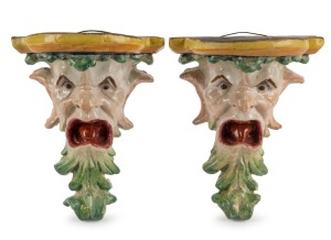 A pair of antique majolica grotesque wall brackets, 19th century, 16cm high