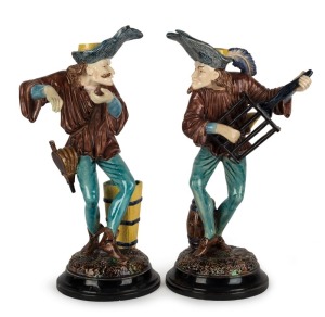 HUGO LONITZ pair of antique German majolica figural candlesticks, 19th century, impressed oval fish mark to bases, 35cm high