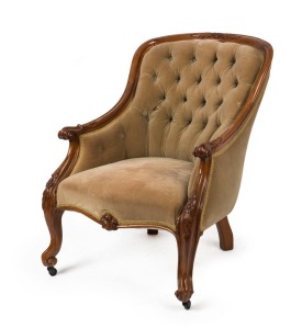 An antique armchair with finely carved walnut frame and olive green upholstery, 19th century,