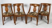 Set of four Biedermeier birch dining chairs with sabre legs, 19th century,