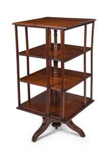 An antique English walnut revolving bookcase with three lower shelves on tri-form base, late 19th century, 106cm high, 53cm wide, 53cm deep