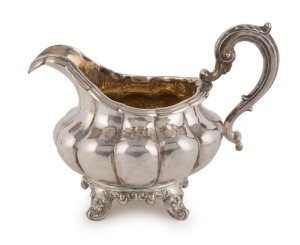 An antique Irish silver milk jug, made in Dublin, 1832, 12cm high, 17cm wide, 280 grams