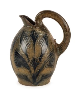 MARTIN BROTHERS antique English art pottery jug adorned with sgraffito foliate decoration, late 19th century, impressed mark "R.W. MARTIN, SOUTHALL", 15cm high