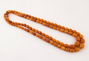 A vintage amber bead double strand necklace, 20th century, 62cm long