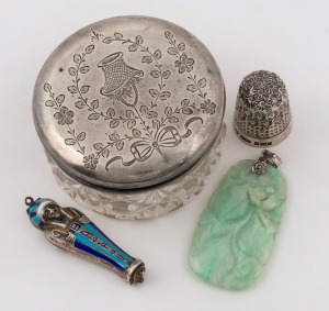 A Chinese carved jade pendant, an Egyptian silver and enamel pendant locket with lift out mummy, a sterling silver thimble, and a sterling silver and crystal jar, 19th and 20th century, (4 items), the jade pendant 4cm high