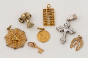 Assorted charms and cross pendant, 9ct, 14ct, 18ct gold and silver, (7 items), 4.5 grams gold total weight