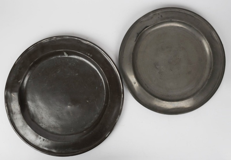 Two antique English pewter chargers, early 18th century, 46.5 and 42.5cm diameter