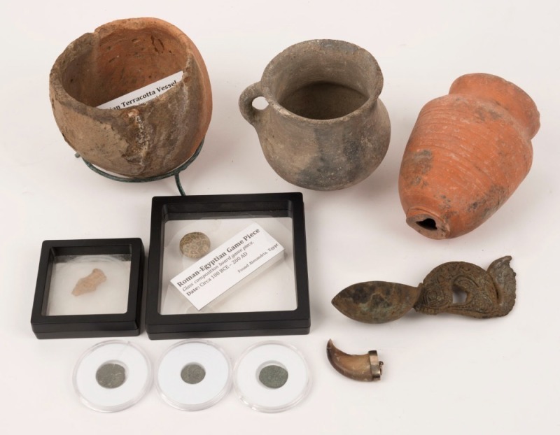 A group of ancient finds including Roman and Egyptian pottery vessels and bronze Roman coins, various dates, (9 items), some with certificates of authenticity, the largest vessel 11cm high