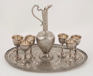 A Persian silver plated drink set, 20th century, (8 items), the tray 35cm wide