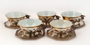 Five Indo-Chinese porcelain teacups with silver mounted dragon handles and saucers, 20th century, ​​​​​​​the saucers 255 grams total