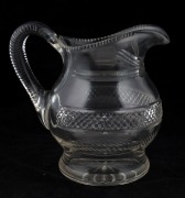 An antique Irish crystal jug, early to mid 19th century, 19cm high, 20cm wide