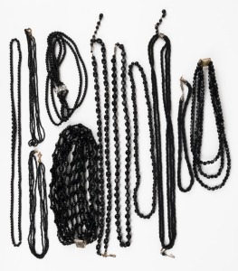 Eleven assorted black glass bead necklaces and chokers, 20th century, ​​​​​​​the largest 72cm long