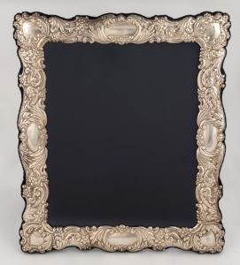 An English sterling silver picture frame with blue velvet and silk lining, 20th century, 32 x 27cm